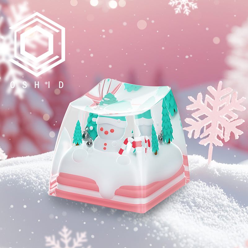 Transparent resin artisan keycap with a miniature snowman scene